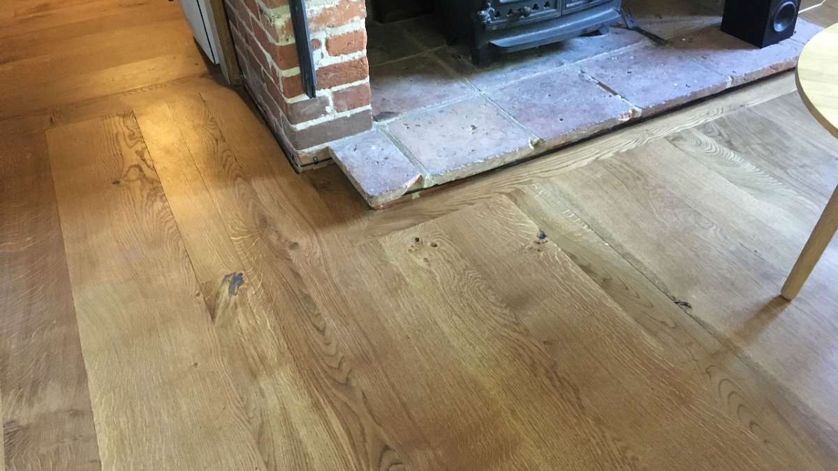 oak flooring boards near fireplace