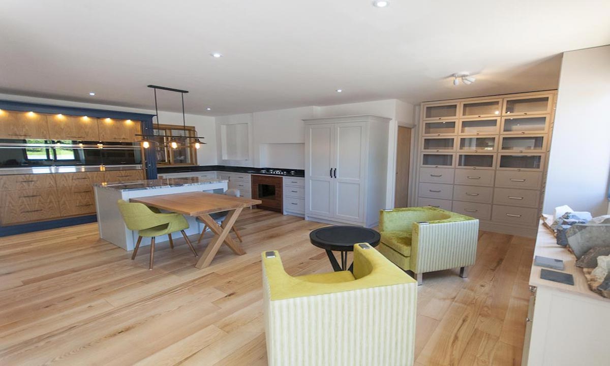 kitchen with comfortable seating area the island, cooking range and larder cupboard