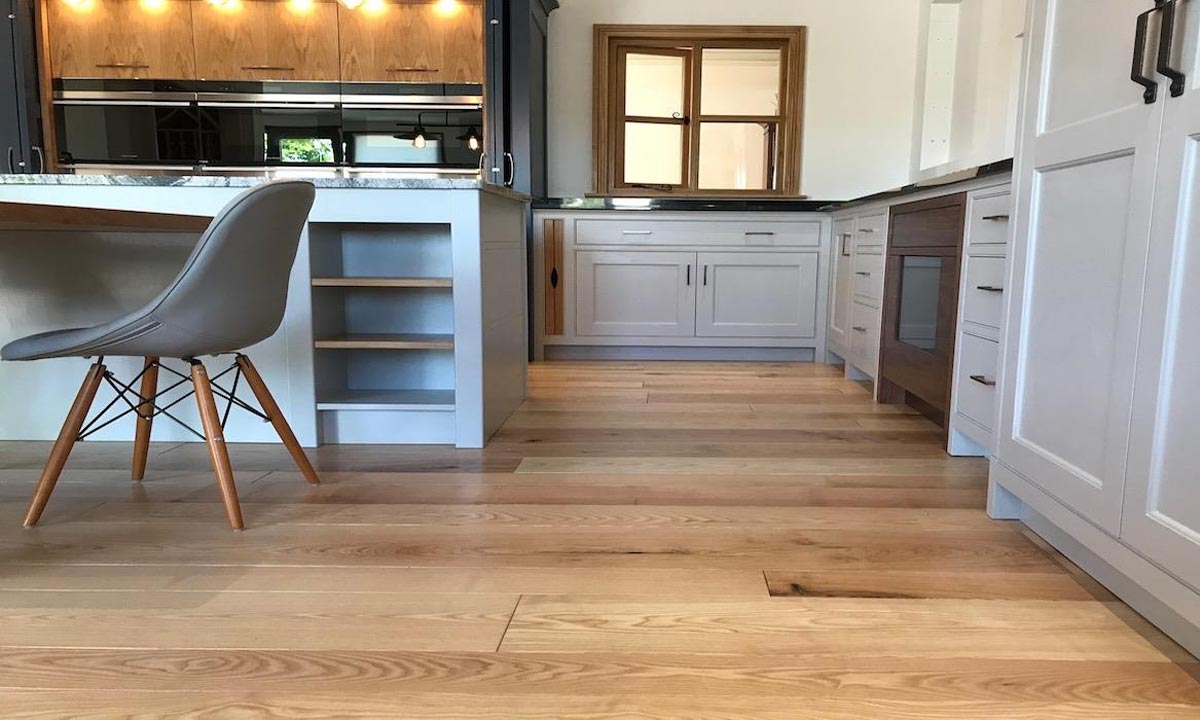 kitchen with three ovens and island with open window