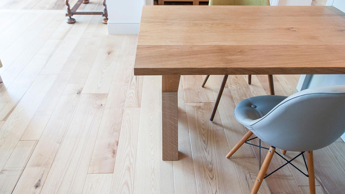 small square kitchen table and chairs on light wood floor