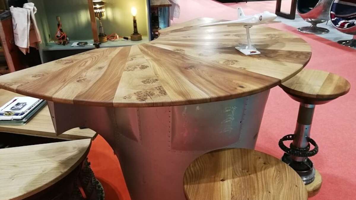 oak semi circular bar top with bar stools using aviation parts