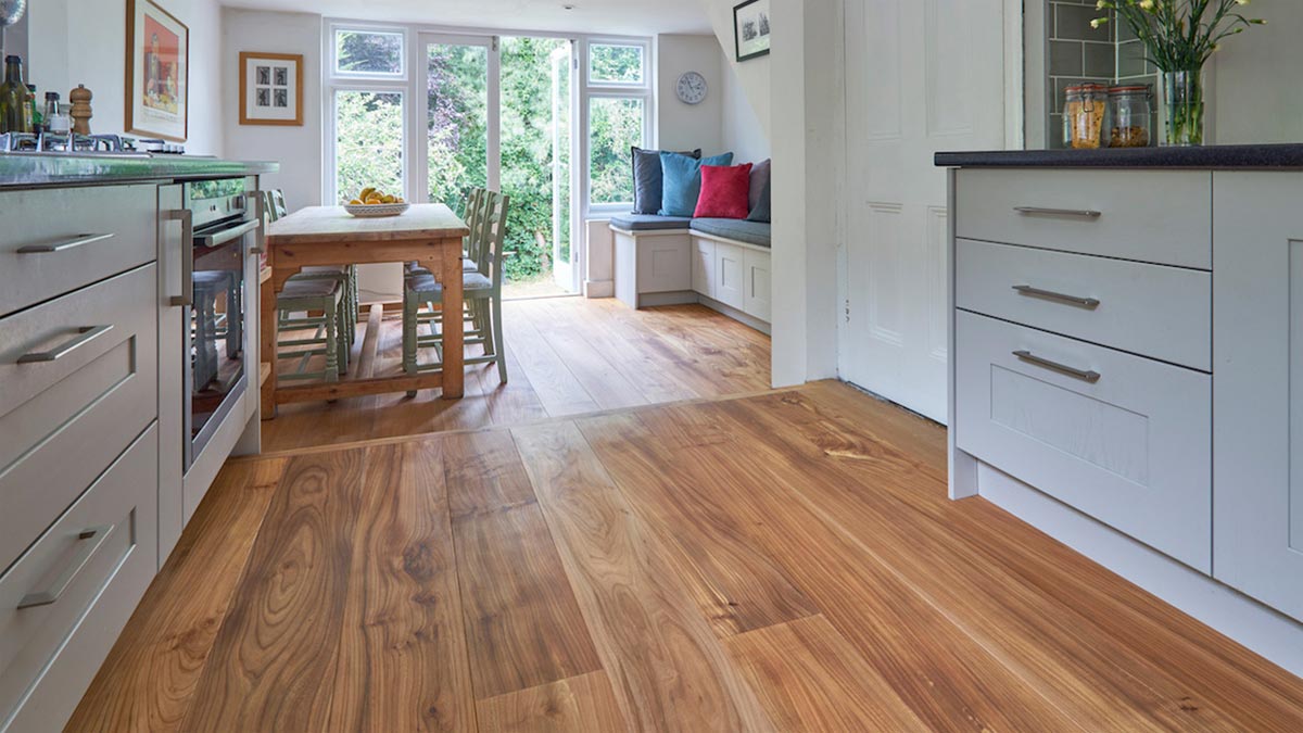 Elm flooring in kitchen with table and bench seat with cushions