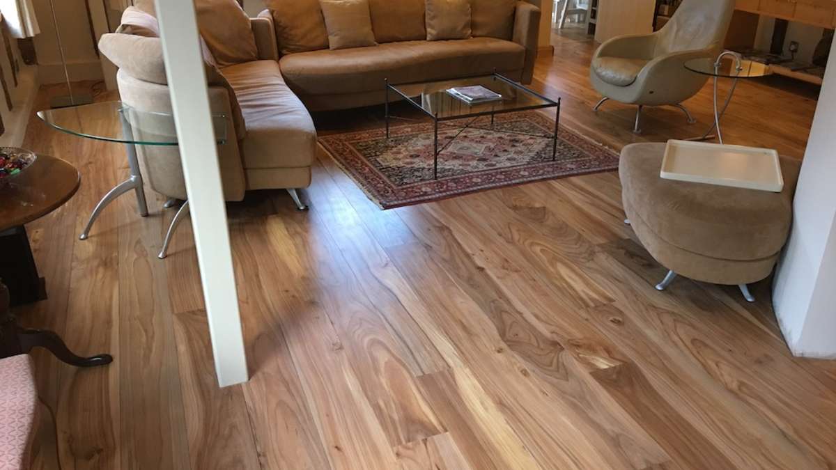 Engineered elm flooring in a sitting room with sofa and chair