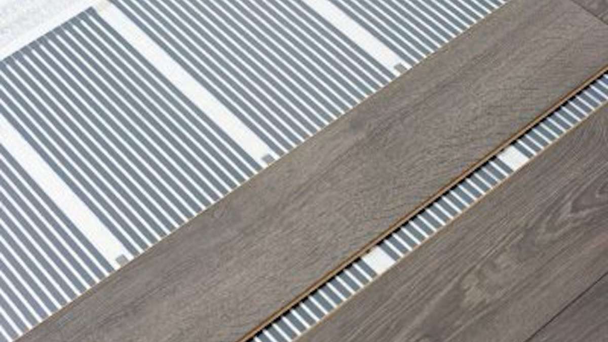 engineered flooring boards laid on under floor heating pad