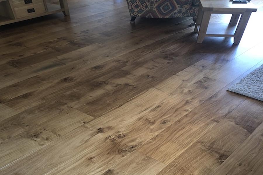 Engineered pippy oak flooring in sitting room with chair