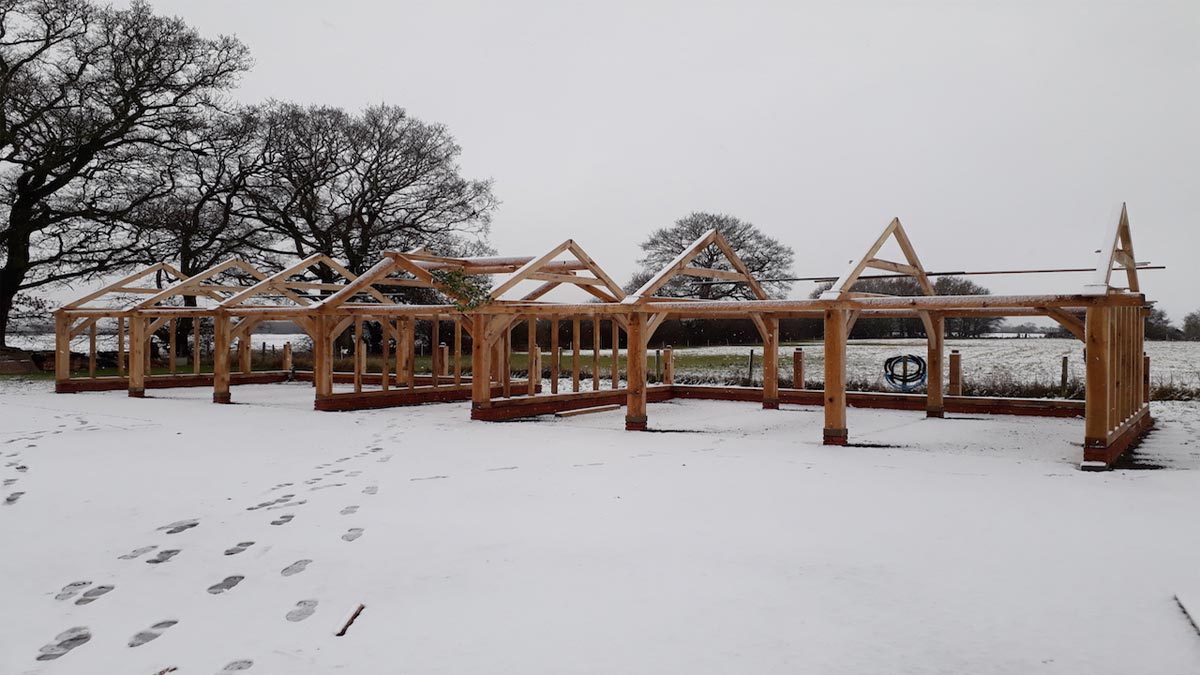 cart lodge oak frame in the snow