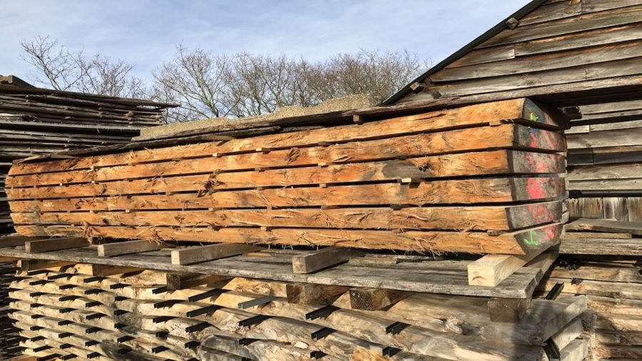 oak in stick drying in a timber yard outside