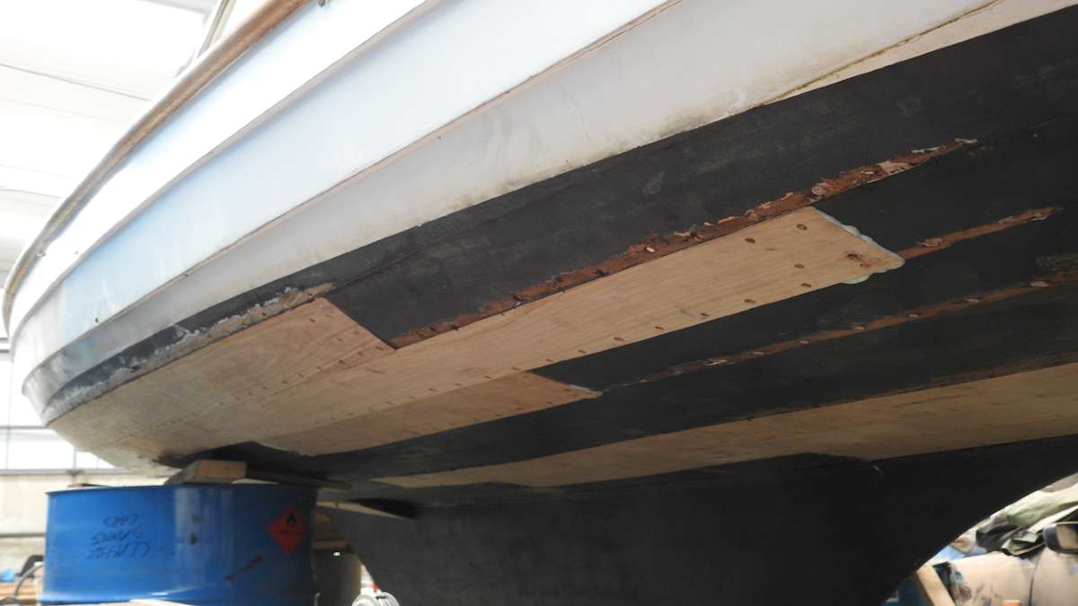 underside of boat being repaired