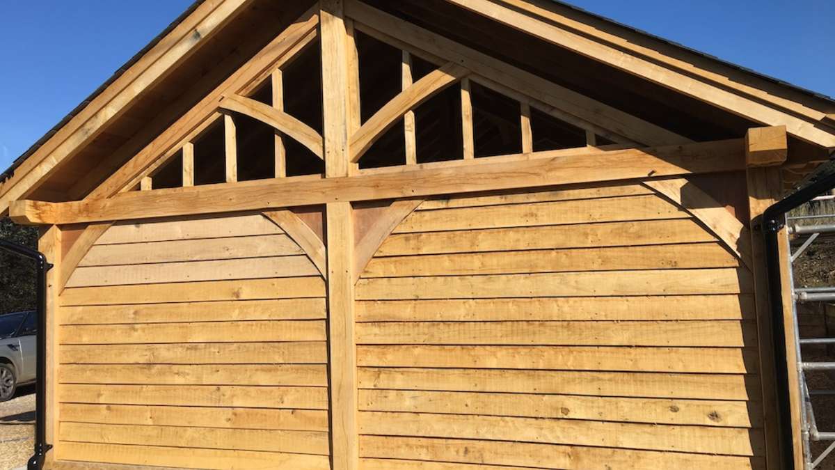 timber clad barn with a frame