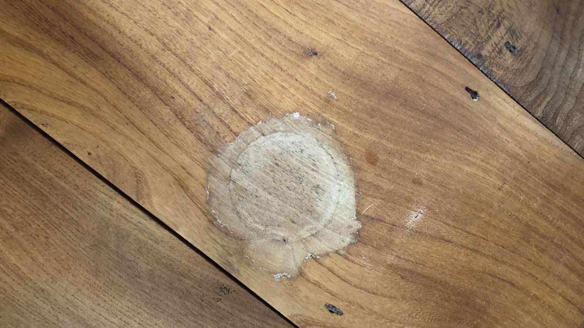 close up of water stain on wood flooring