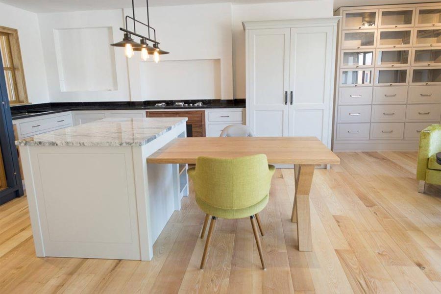 solid ash flooring grey kitchen cabinetry and lime furniture