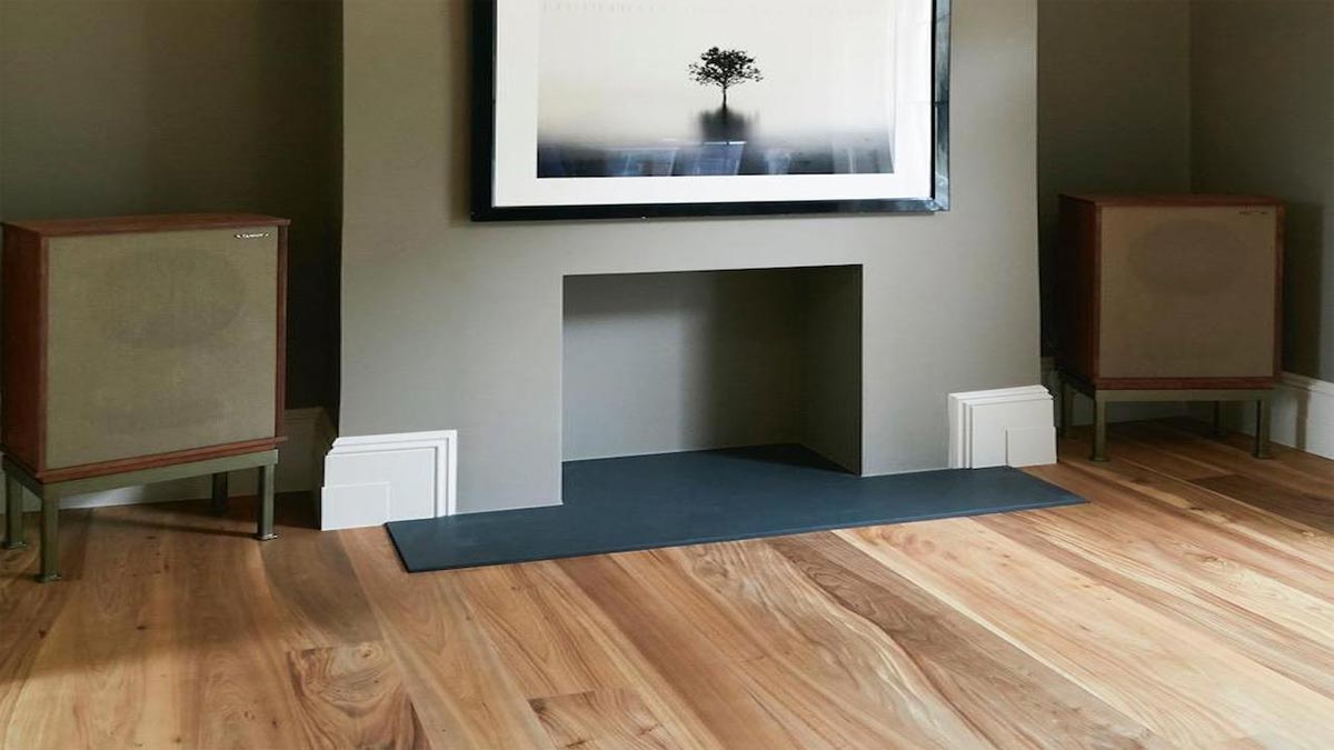 elm flooring with fireplace and painting