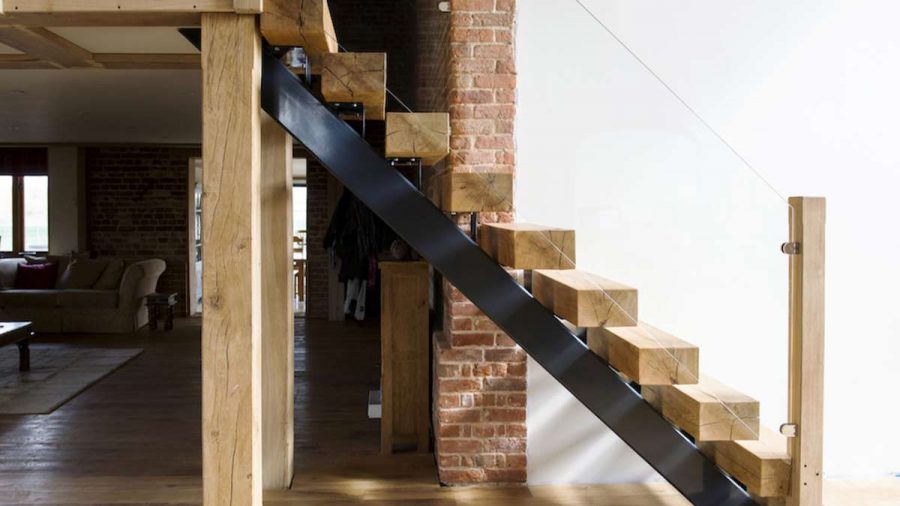 side view of sleeper oak and glass stair case with floating steps