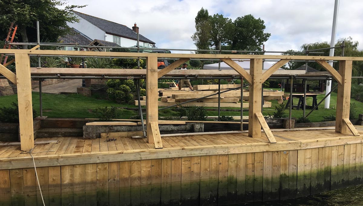 four solid oak beams to support boat house