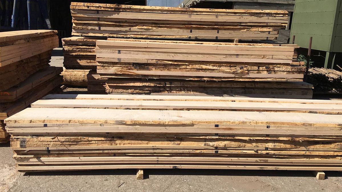 sweet chestnut boards in a stack in timber yard