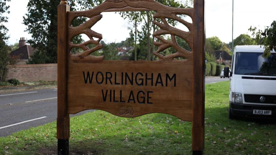 worlingham village sign by roadside