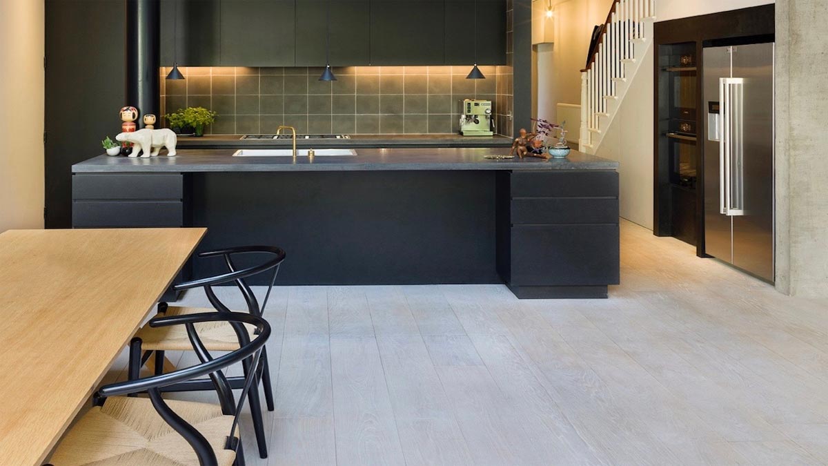 kitchen with large island american style fridge and double hob